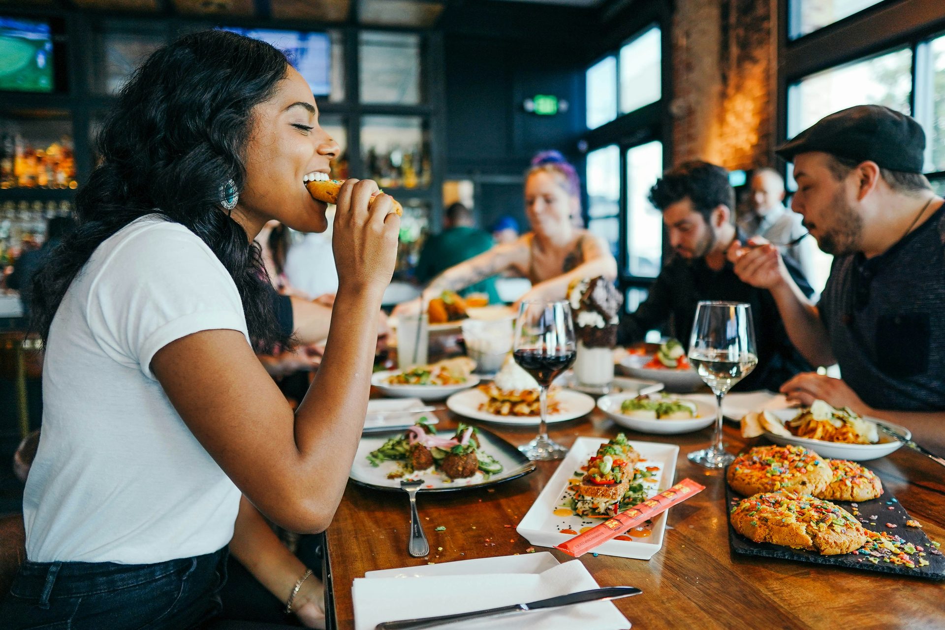 Guests dining in a warmly lit restaurant