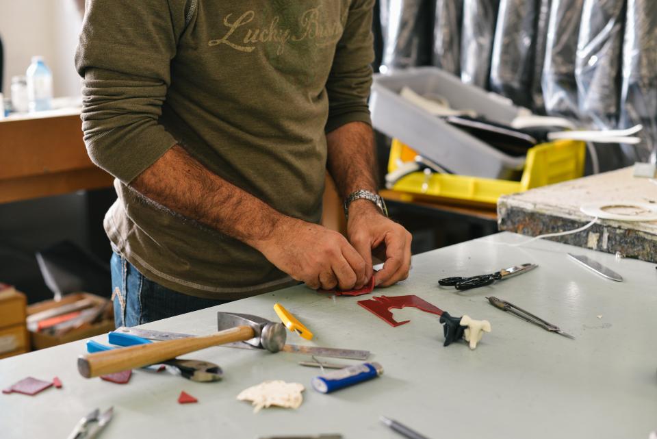 Technicians assembling components on a workbench