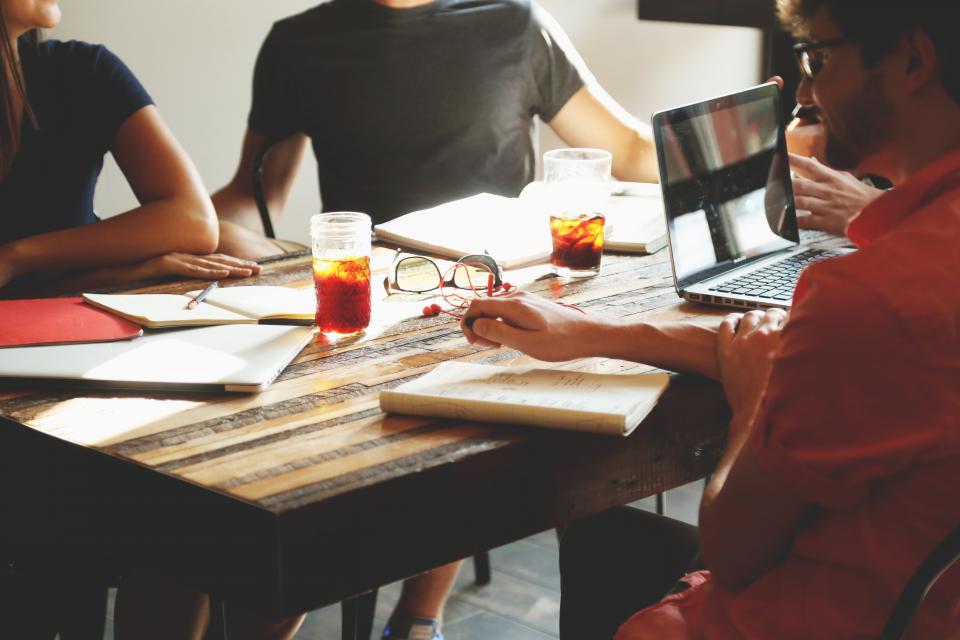 Team collaborating around a shared table in an open office
