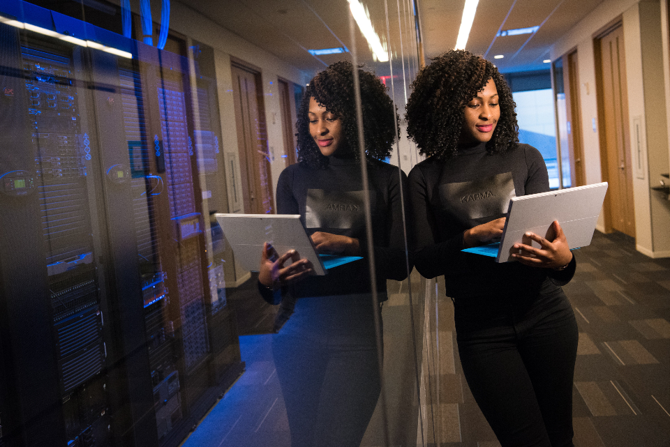 Engineers reviewing systems inside a data centre